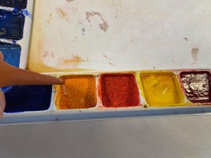 Adding water to dried watercolor paints